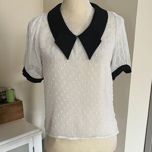 White Swiss Dot Blouse with Black Contrast Collar. Says med. But it’s a sm.